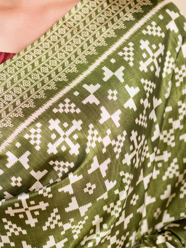green patola print saree